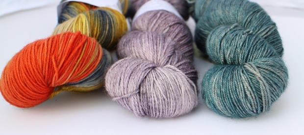 L-R 'Anticipation' by Ripplescrafts, 'Angelis' by Rainbow Heirloom and 'On The Rocks' by Gingers' Hand Dyed.